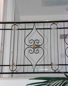 Railing with bronze top rail and scrolls